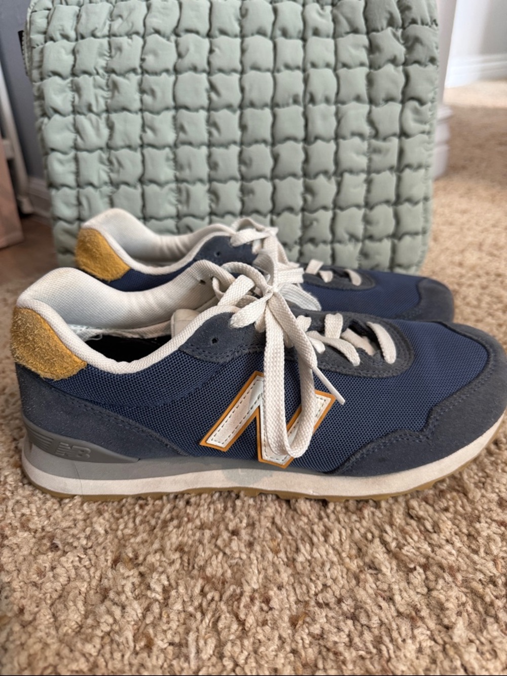 New Balance woman’s Navy and Mustard Lace-Up Sneakers